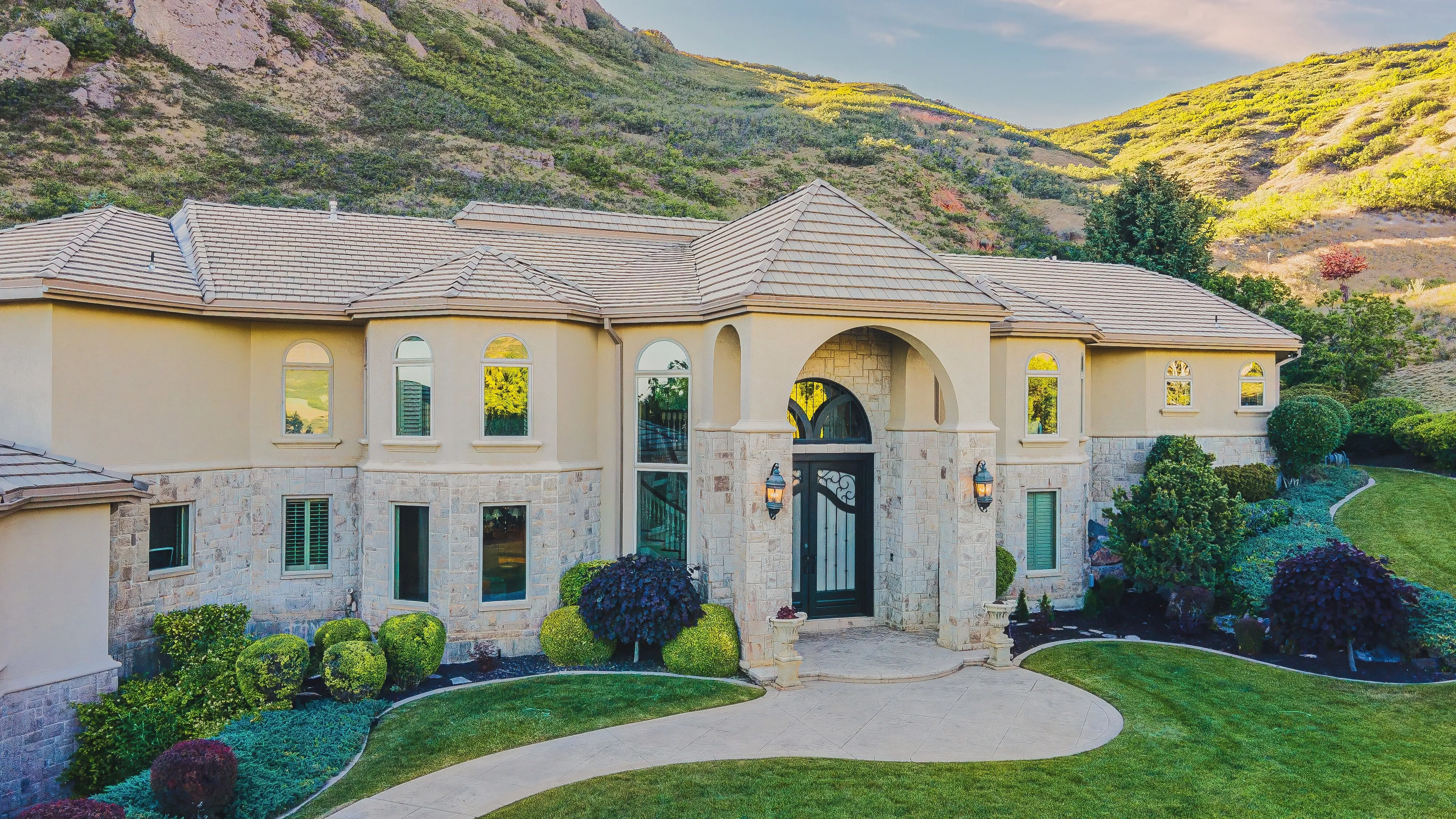 Front elevation of 1261 Oak Forest Road against the Wasatch foothills